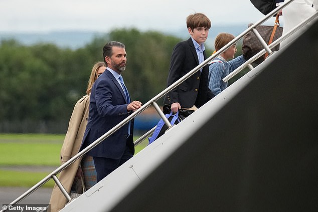 Donald Trump Jr., son of U.S. President Donald Trump, boards the plane at Prestwick Airport