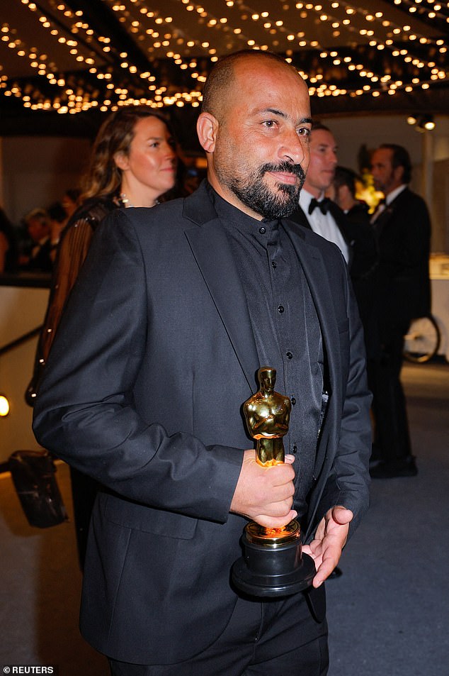 Oscar-winning Palestinian filmmaker Hamdan Ballal was reportedly attacked by masked Israeli settlers on the West Bank before being detained as he was being treated for his injuries