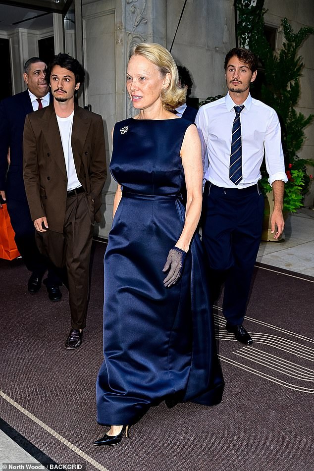 Anderson exuded glamour as she departed for the premiere alongside her boys