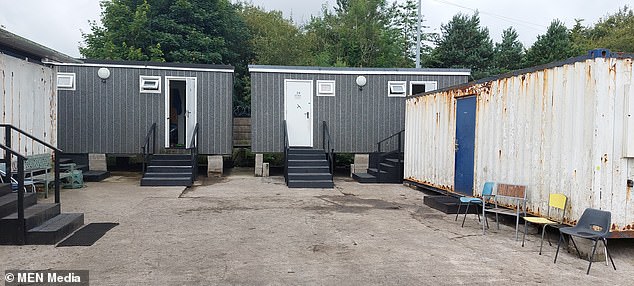 The shipping containers had been set up on a scrapyard to house the illegal workers