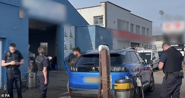 A car wash being raided by Immigration Enforcement officers in August