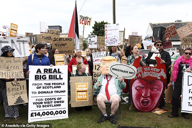 Demonstrators gathered near Trump International Golf to voice opposition to the U.S. President ahead of his scheduled visit to the golf course in Balmedie