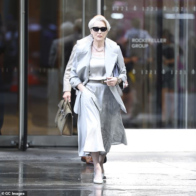 She emerged looking every inch her fashion editor character in a sleek silver look