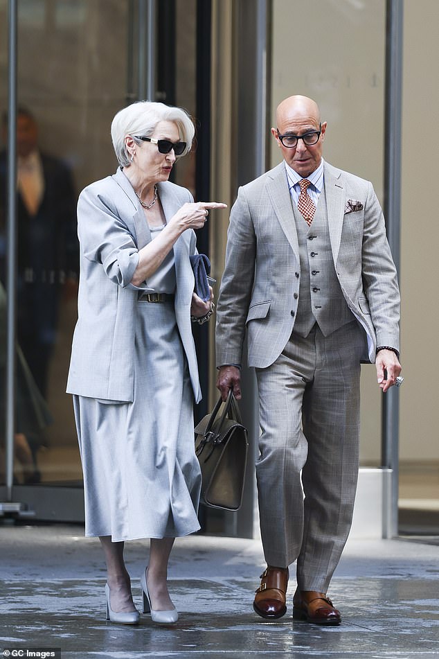 She chatted with the dapperly-dressed Tucci
