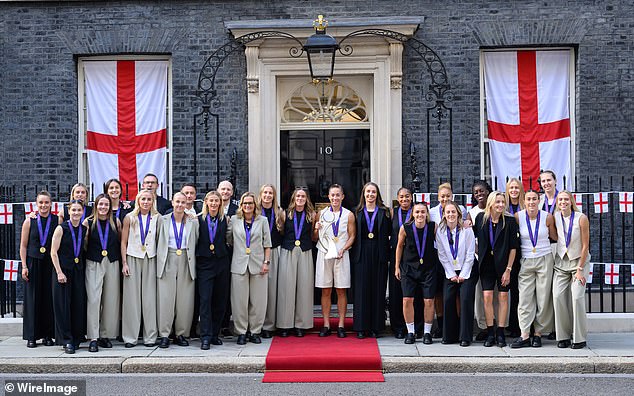 The England squad wearing their winners' medals at Downing Street for a reception at No 10