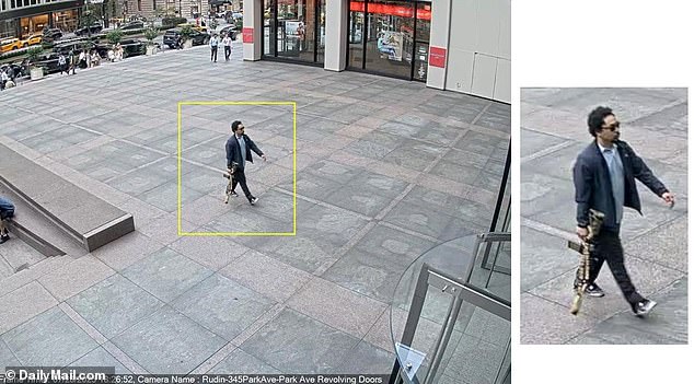 Photos posted online showed the gunman wearing a sport coat and button-down shirt while carrying the large rifle near a midtown Manhattan office building