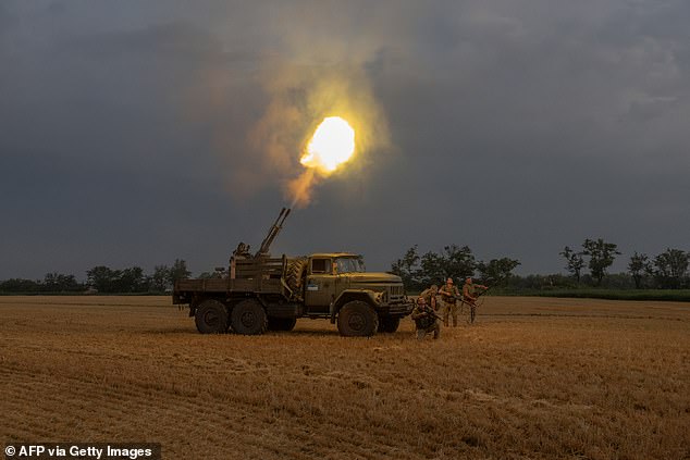 Ukrainian servicemen fire an autocannon towards a Russian drone in the Dnipropetrovsk region