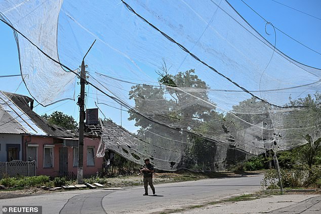 A street in the Zaporizhzhia region protected with anti-drone nets due to Russia's constant bombardment