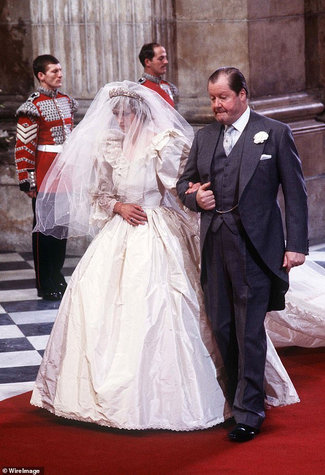 Diana enters St. Paul's Cathedral on the arm of her father, Earl Spencer, ahead of her marriage to Charles