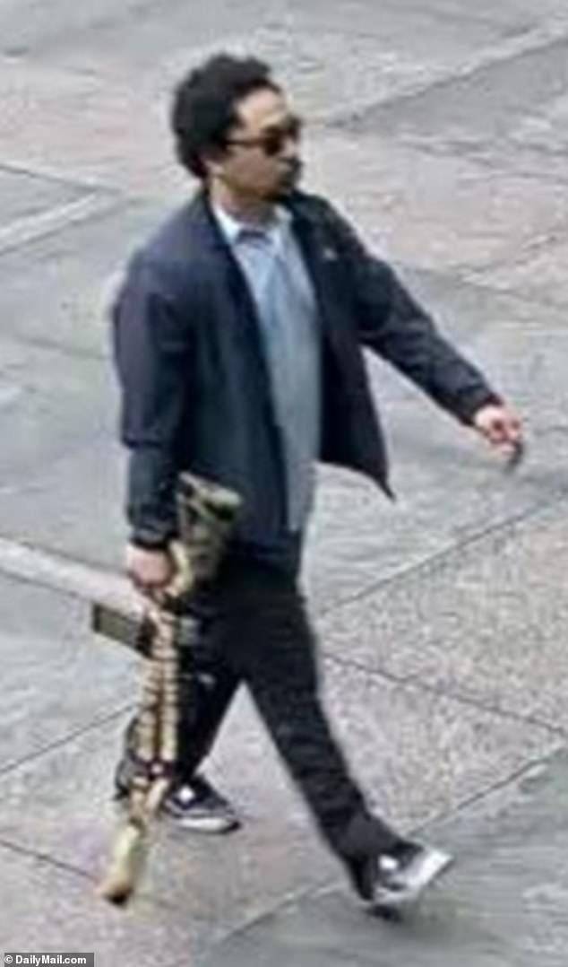 Shane Tamura, 27, was caught on chilling surveillance footage wearing a sport coat and button-down shirt while carrying a large M4 assault rifle into the skyscraper at 345 Park Avenue in Midtown Manhattan Monday evening