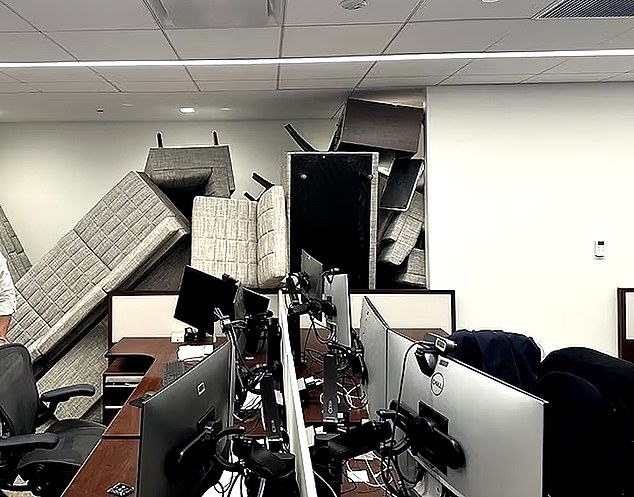 The pile of furniture was stacked as high as the ceiling of the 32nd floor of the building
