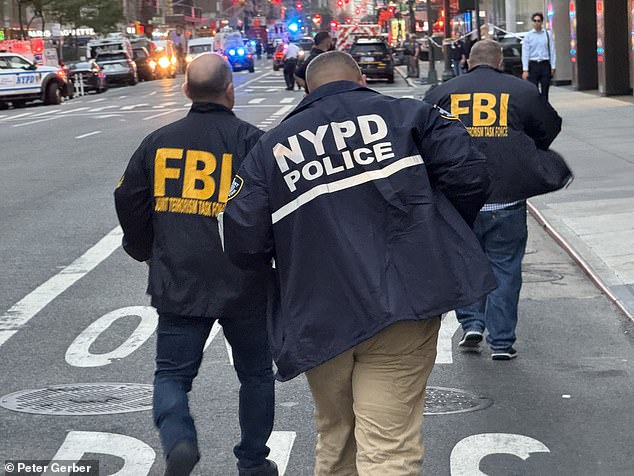 Police officers and federal agents rushed to the scene of the shooting Monday night