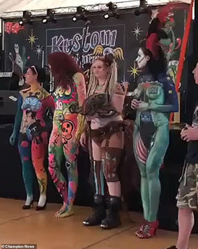 The model insisted she struggled to walk, get out of a car and dress herself because of nerve damage. Picture shows bodypainting artist and model Kae Burnell Chambers (3rd from left)