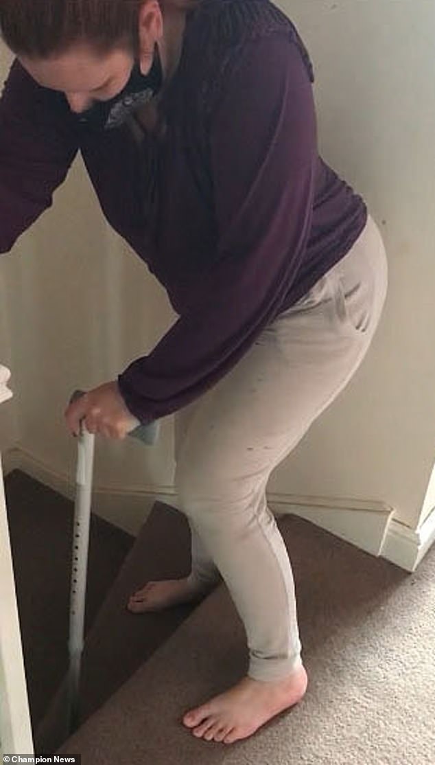 Model Kae Burnell Chambers is seen in video footage during a medico legal visit where she 'displayed a laboured gait and used a stick'