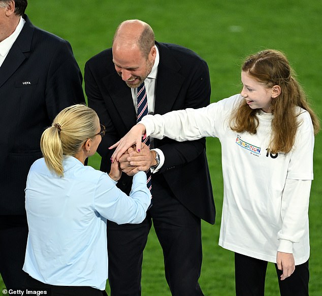 Greta has now revealed she felt 'nervous' at first but soon felt welcomed by the players. Pictured greeting England manager Sarina Wiegman