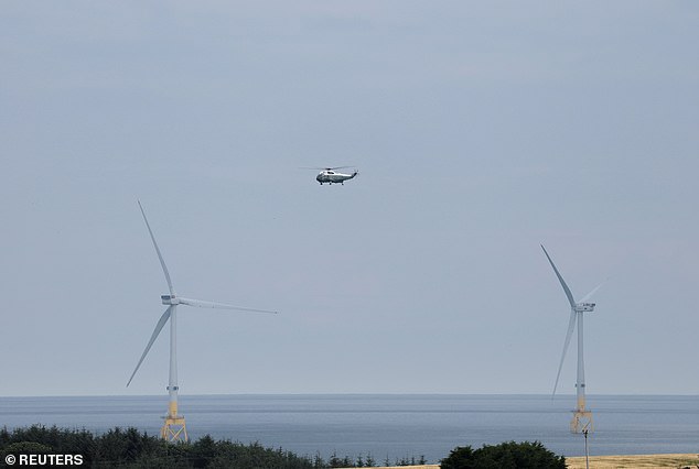 Wind turbines pictured below Marine One, carrying U.S. President Donald Trump, towards Trump International Golf in Aberdeen on Monday. He branded wind turbines 'ugly monsters'