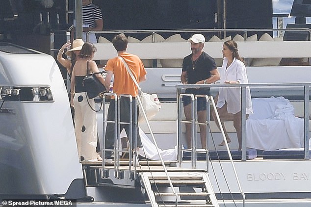 Jackie looked chic in polka dot trousers