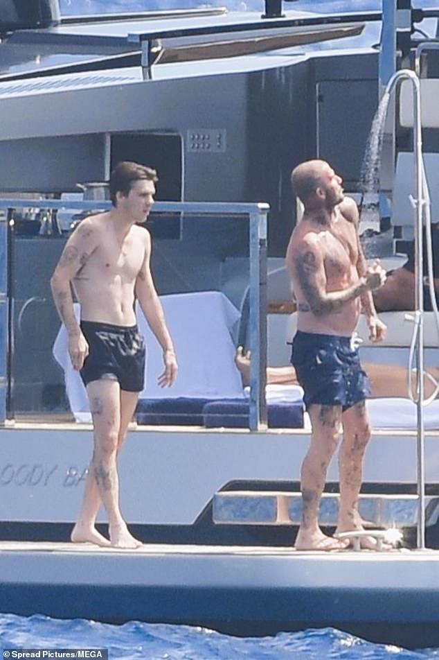 Shirtless David showered off after a dip