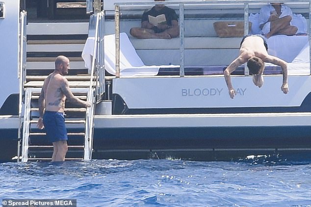 Cruz showed off her skills as he dived into the water from the boat