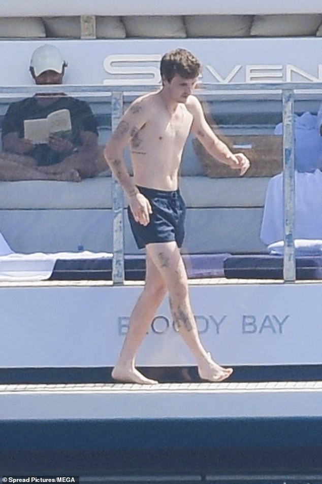 The youngest of three sons showed off his muscular physique