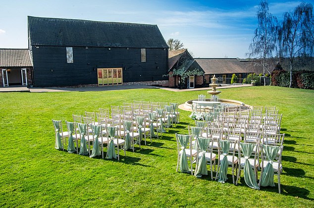 The beautiful barn house at Crondon Park in Essex, with an outdoor ceremony in front of a fountain