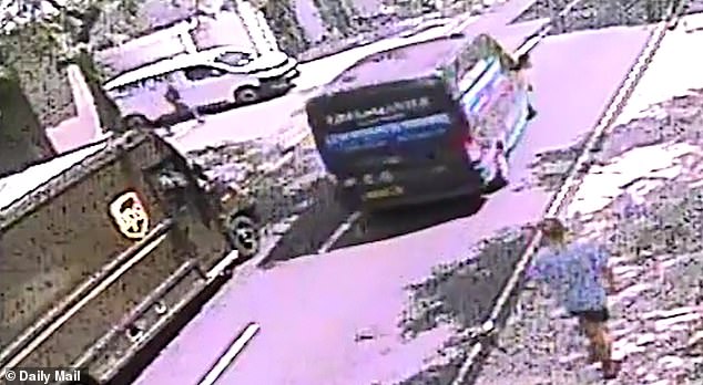 CCTV shows the suspected attacker (left) fleeing down the side road past the white van