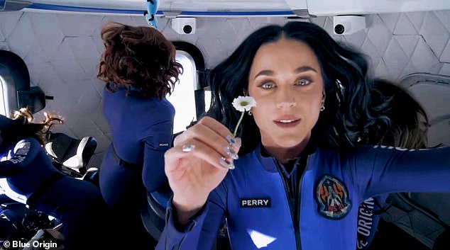 Perry was seen floating inside the capsule holding a daisy in a nod to Daisy