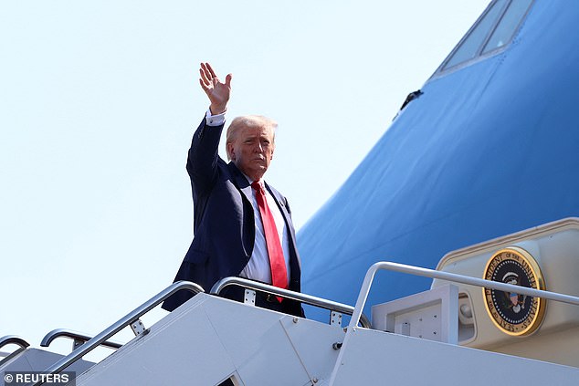 President Donald Trump waves from the tarmac at Joint Base Andrews on Friday before departing for Scotland. The wife of a Secret Service agent was discovered trying to take a support flight to Scotland as part of Trump's trip