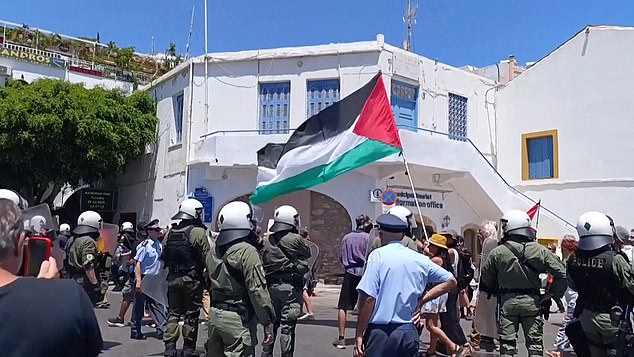 Protesters waved Palestinian flags as police watched on