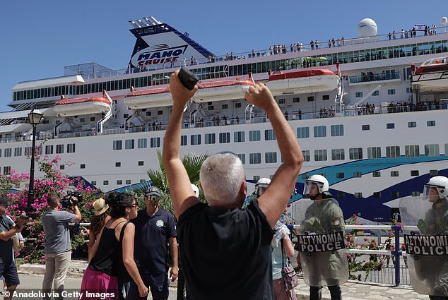The protest mirrored those the previous day when the Crown Iris docked in a port on the eastern Greek island of Rhodes, where clashes broke out between riot police and demonstrators