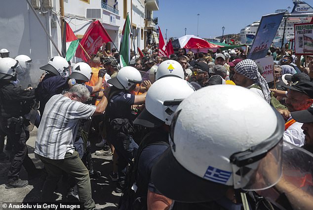 Officers even used pepper spray at one point to keep the protest in control as scuffles broke out between activists and the police, local media reported