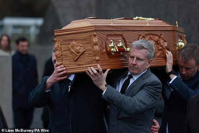 Patrick, 54, looked bereft as he carried Mary's coffin through his home village, where he was joined by close family and friends at the Church of the Sacred Heart