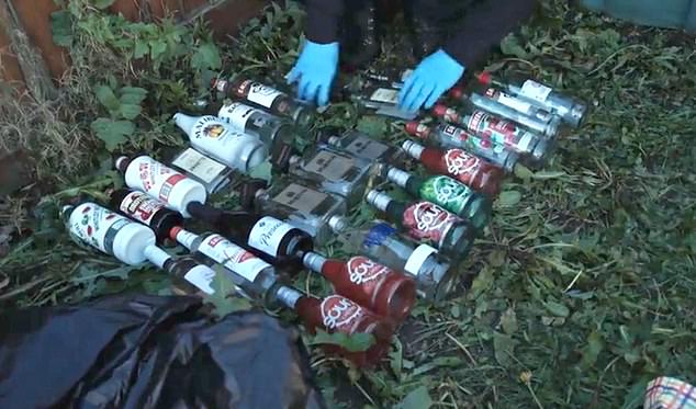 Alcohol bottles found during the police's search of France's home
