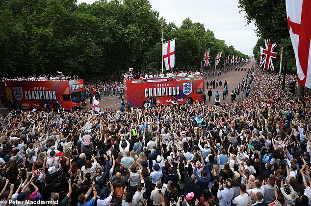 England's football royalty were greeted by thousands as they cruised down the Mall