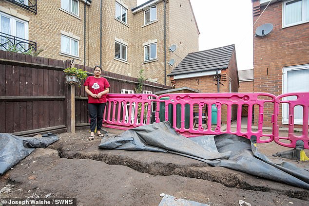 The garden of Manpreet Kaur (pictured) with a huge ground fissure running through it