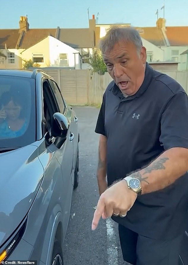 Footage shows the driver of a grey Nissan denying that he was involved in an accident