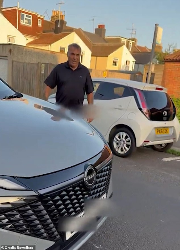 At one point the grey Nissan driver goads the other motorist to call the police as he to continues to deny that he hit his car