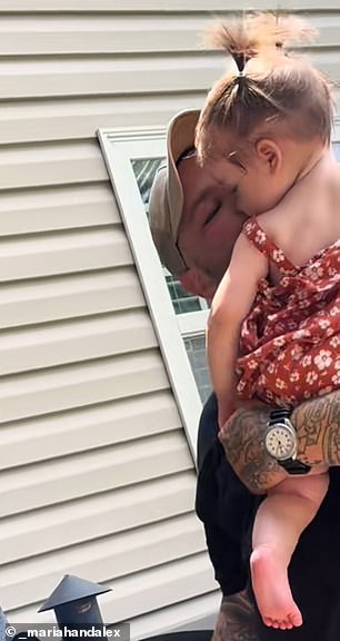 Alex is seen giving the baby he thought was his daughter a kiss