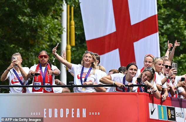 Flags and mobile phones filled the sky, and everyone lurched forward for a glimpse of our returning champions on their victory parade