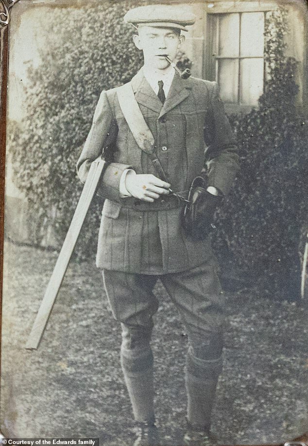 Valet Alf Edwards pictured with gun slung over his arm