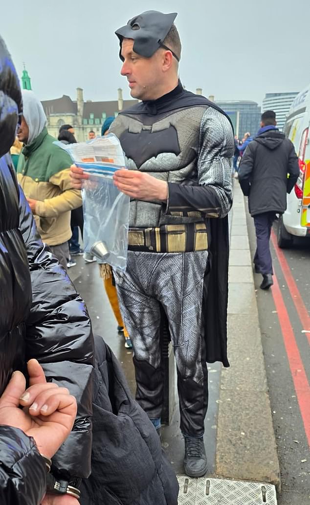Inspector Darren Watson dressed as Batman during an operation targeting scammers on Westminster Bridge