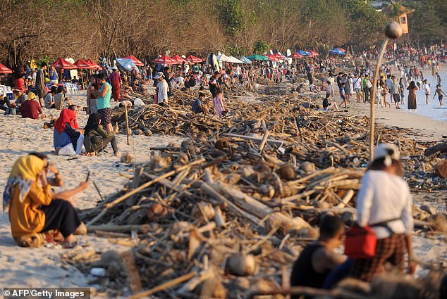 A general view shows debris and rubbish washed ashore at Kuta beach on Indonesia's resort island of Bali on February 15, 2019