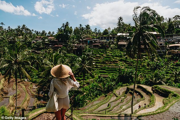 Pictured: Woman enjoying Bali rice fields