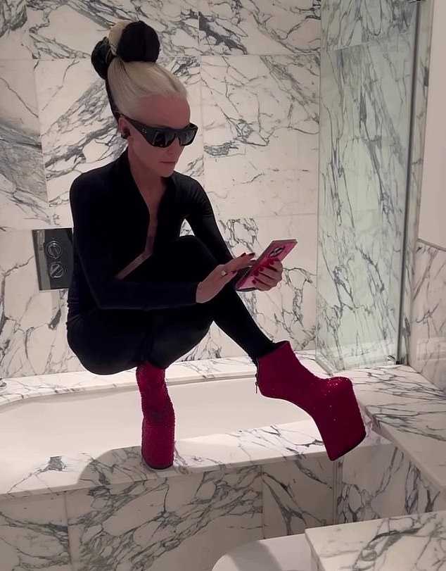 The heiress demonstrated how easy it is for her to balance in her trademark seven-inch heel-less platforms as she attempted the 'Nicki Minaj challenge' for a music video, pictured