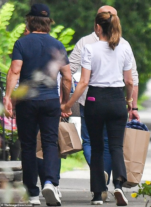 Meanwhile Ana cut a casually stylish figure in a simple white t-shirt