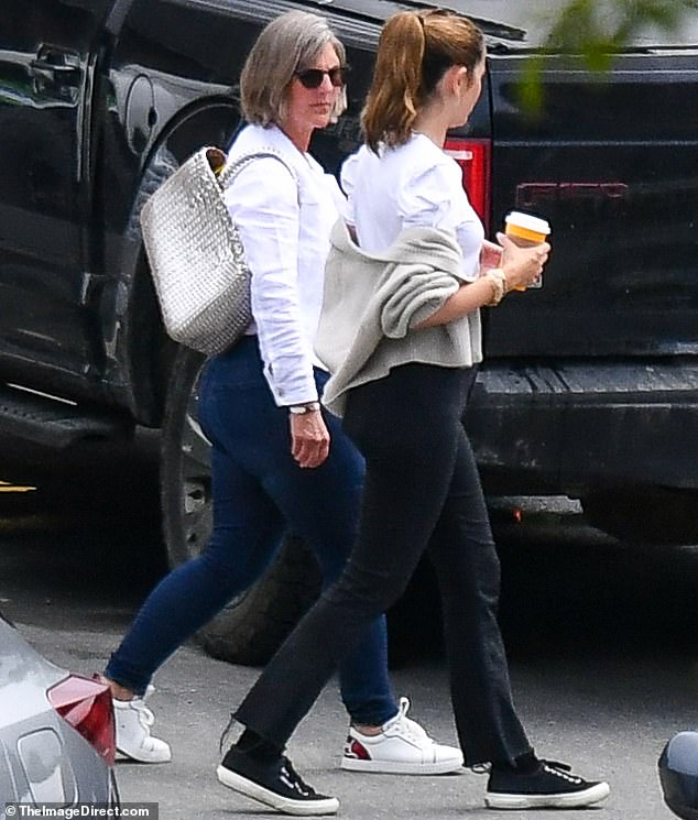 She was able to balance her quality time with Tom with a stroll with a female pal