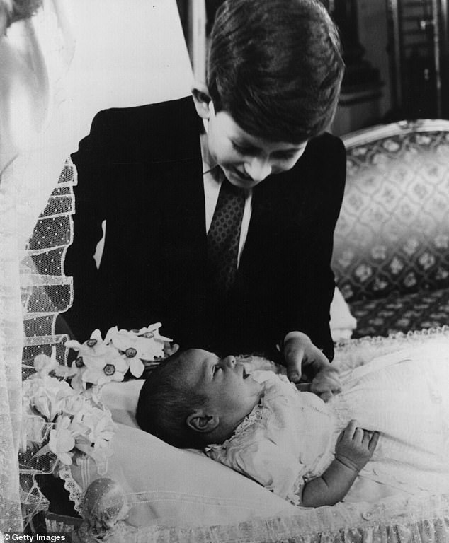 Prince Charles admires his baby brother Andrew. He would be the last of the Queen's children to be born using twilight sleep