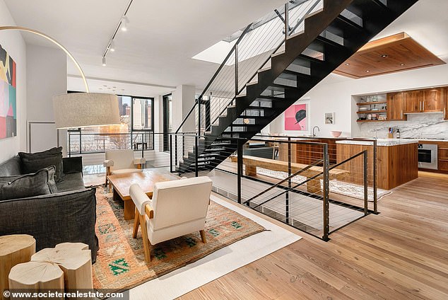 His old rental - which sits in the same complex building - included a foyer and the kitchen alongside two sets of stairs inside Sheeran's Brooklyn apartment