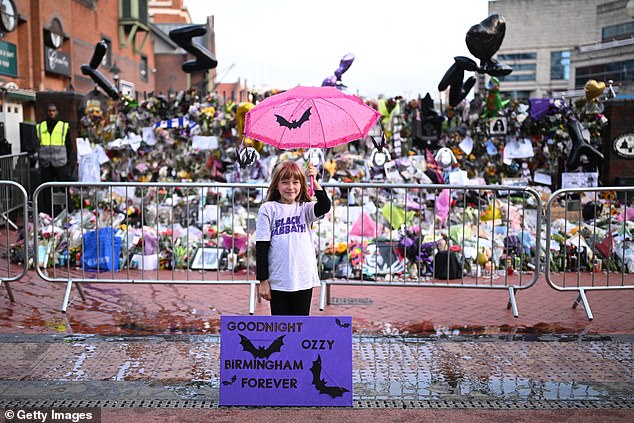 Masses of floral tributes have been piling up at Birmingham's Black Sabbath Bridge