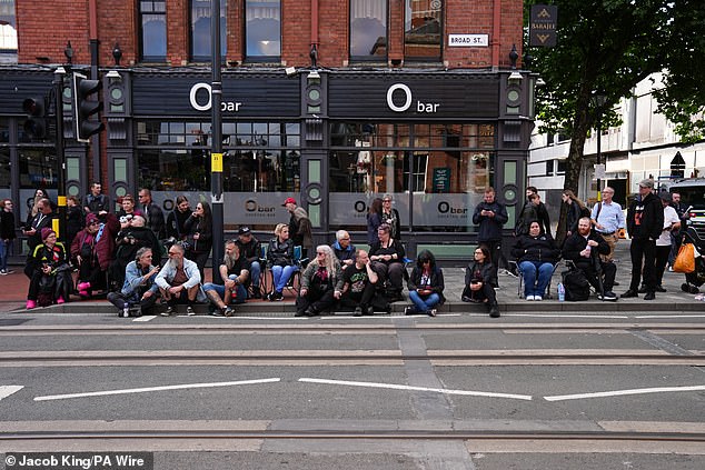 Crowds have been gathering early along Broad Street in Birmingham before today's procession